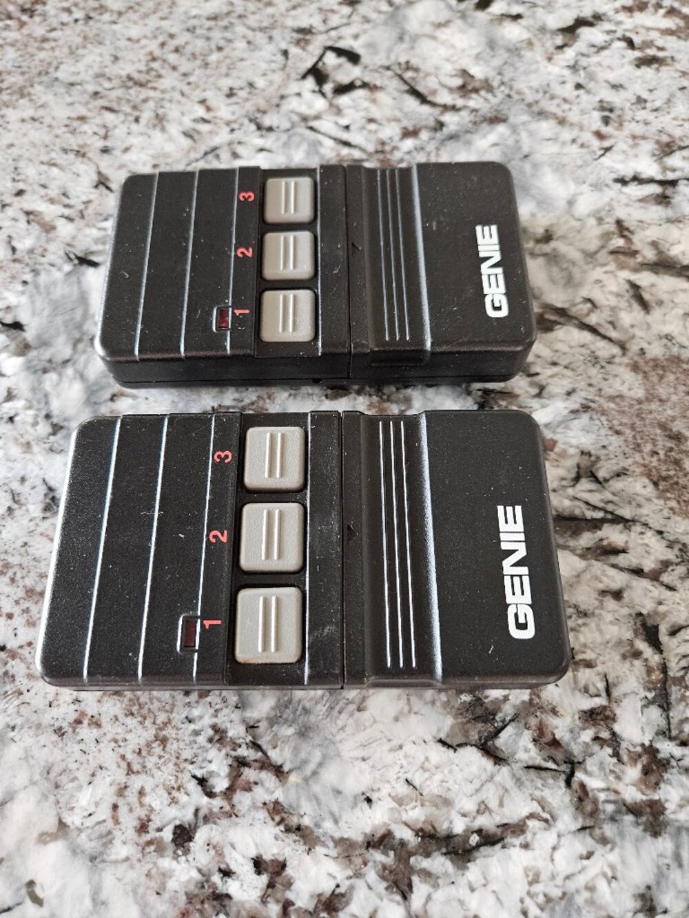 RARE VINTAGE PAIR OF GENIE GARAGE DOOR REMOTE CONTROLS WITH 3 BUTTONS, #GT90-3